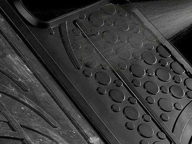 Black rubber mat being cleaned